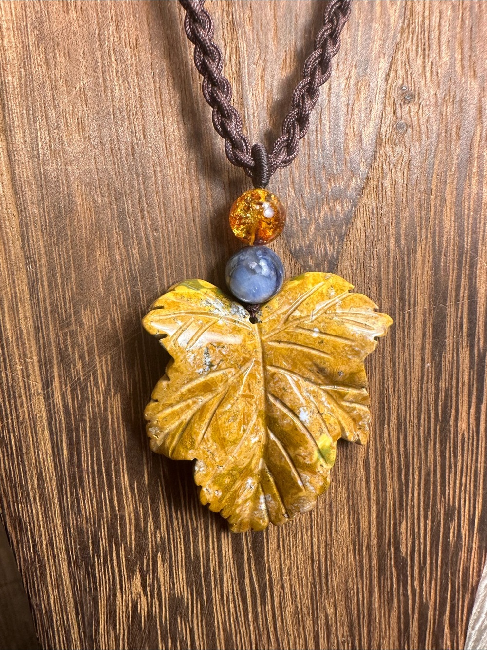 Yellow Ocean Jasper Leaf Carving Pendant Necklace on Brown Braided Rope - Picture 7 of 13